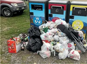  ??  ?? Rubbish has overflowed from the new bins at the Lowburn freedom camping site, near Cromwell, since they were installed over summer.