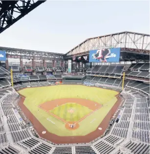  ?? TONYGUTIER­REZ/AP ?? Globe Life Field in Arlington, Texas will allow fans at a little more than one-quarter capacity for the World Series. Both teams will play at the same site for the first time since 1944.