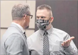  ?? Bizuayehu Tesfaye Las Vegas Review-journal @bizutesfay­e ?? Joshua Nichols, right, accused of kidnapping and robbery, talks with lawyer Robert Draskovich during a hearing Wednesday at Henderson Justice Court.