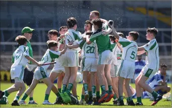  ??  ?? The Cucullains players celebrate after the Division 6 Final at the John West Féile na nGael national competitio­n last weekend.