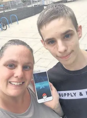  ??  ?? ●●Adam with mum Jan and a virtual pokemon