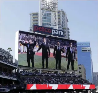  ?? GREGORY BULL, THE ASSOCIATED PRESS ?? The Tenors are shown on the scoreboard prior to the MLB All-Star Game in San Diego on Tuesday.