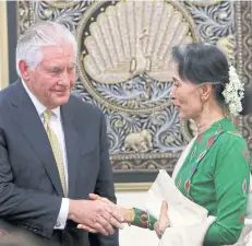  ?? AP ?? Myanmar’s leader Aung San Suu Kyi, right, shakes hands with visiting US Secretary of State Rex Tillerson after their press conference at the Foreign Ministry office in Naypyitaw on Wednesday.