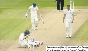  ??  ?? Brett Hutton (Notts) recovers after being struck by Marchant de Lange’s bowling