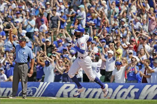  ?? Nuccio DiNuzzo/ Getty Images ?? Jason Heyward circles the bases after hitting a two- run home run in the fifth inning off Pirates starter Trevor Williams that broke a 3- 3 tie. Williams, below, left the game in the sixth inning after giving up two more home runs.