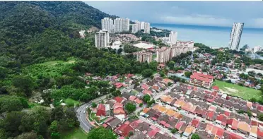  ??  ?? Aerial view of Jalan Lembah Permai in Tanjung Bungah, where the North Coastal Paired Road from Teluk Bahang will end in the L-shaped bend of the road.