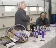  ?? SUBMITTED PHOTO ?? Scott, right, and Anna Larsen, left, of Windy Hill Farm, specialize in English Lavender which then is used in their products. They also manage a 50-tree orchard and harvest seasonal fresh produce for their farm stand. This photo shows the Windy Hill Farm display at the 2018 Agricultur­al Summit.