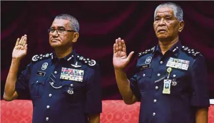  ?? BERNAMA PIC ?? Inspector-General of Police Tan Sri Mohamad Fuzi Harun (left) and his deputy, Tan Sri Noor Rashid Ibrahim, at the Police College in Cheras, Kuala Lumpur, yesterday.