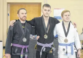  ?? FRAM DINSHAW/TRURO NEWS ?? Medal winners in the under-145 lb category were, from left, Zack Little (silver) and Taylor Mccafferty (gold) of Marmac Athletics, and Neil Mcdonald (bronze) of Halifax.