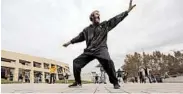  ?? RICK BOWMER/AP ?? David Christophe­r Coons, who is homeless, performs tai chi in Salt Lake City. Coons was fired from his job as an electricia­n about five years ago and has been homeless since.