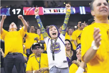  ?? Santiago Mejia / The Chronicle ?? Jack Covin, 12, and the Oracle Arena crowd had plenty to cheer about Thursday. The Warriors led most of the way, pulled away at the start of the third quarter and coasted to an easy win in Game 1.