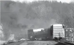  ?? Tribune News Service/getty Images ?? Smoke rises from a derailed cargo train in East Palestine, Ohio, on Feb. 4