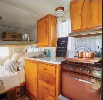  ??  ?? Above: The camper retains its original birch cabinetry and Formica counter