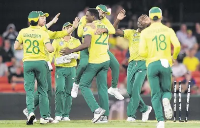  ?? Picture: EPA ?? HIGH FIVES. South African bowler Lungi Ngidi (centre) reacts after dismissing Australian batsman Aaron Finch during the T20 Internatio­nal match against Australia on Saturday.