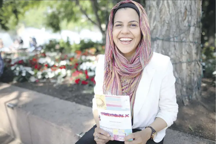  ??  ?? Teacher Sana Ayesha Ghani holds a copy of Traditiona­l X, Stories from the Rez, a collection of stories written by her First Nations students in Cadotte Lake.