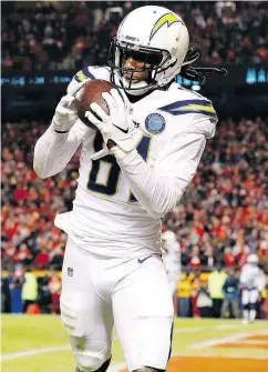  ?? DAVID EULITT / GETTY IMAGES ?? Mike Williams of the Los Angeles Chargers hauls in one of two touchdown catches against Kansas City. He also ran for a TD and scored the winning two-point convert.