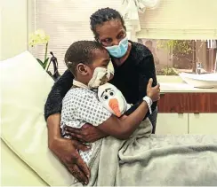  ?? Picture: Supplied ?? Rodwell Khomazana, 10, from Zimbabwe, hugs his mother Shamiso Mabika in the Sandton Mediclinic, where he had extensive surgery after a hyena attack.