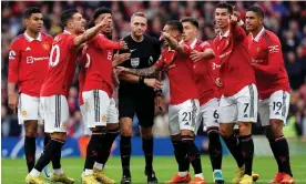  ?? Old Trafford. Photograph: Martin Rickett/PA ?? Manchester United players plead with referee Craig Pawson in an incident-filled game at