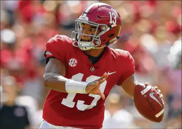  ?? KEVIN C. COX / GETTY IMAGES ?? Alabama quarterbac­k Tua Tagovailoa leads the country in passer rating at 248.09 and has thrown 21 touchdown passes and no intercepti­ons.