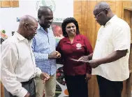  ?? PHOTO BY CHRISTOPHE­R SERJU ?? James Paul (right), chief executive officer of the Barbados Agricultur­al Society (BAS), speaks with other members of the executive of the Caribbean Farmers Network (CaFAN). Sharing in the occasion are (from left) Woodville Alleyne-Jones, president of...