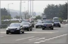  ?? LEE JIN-MAN — THE ASSOCIATED PRESS ?? A motorcade carrying South Korean President Moon Jae-in arrives at the Unificatio­n Bridge, which leads to the Panmunjom in the Demilitari­zed Zone, in Paju, South Korea, Friday.