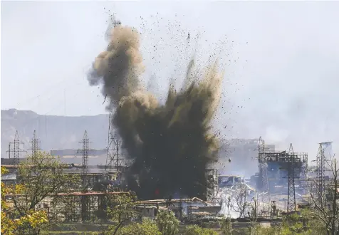  ?? — ALEXANDER ERMOCHENKO/REUTERS ?? An explosion wrecks more of the Azovstal steel works Wednesday in the southern port city of Mariupol, Ukraine, as the plant's defenders continue to hold out against Russian forces.