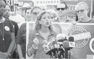  ?? TAIMY ALVAREZ/SOUTH FLORIDA SUN SENTINEL ?? Congresswo­man Debbie Wasserman Schultz answers questions about a package delivered to her district office.