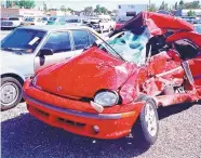  ?? JOURNAL ?? MaryMargar­et Sosa and her red Dodge Neon didn’t stand a chance against a speeding truck that ran a red light at Eubank and Academy NE and crashed into her early Aug. 26, 1998. Sosa, 26, died instantly.