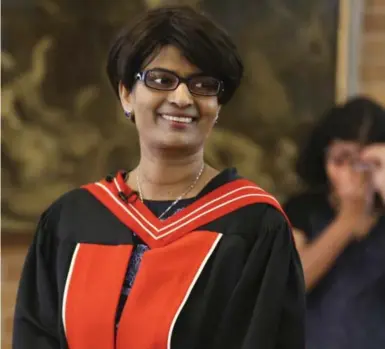  ?? RICHARD LAUTENS/TORONTO STAR ?? Precilla Veigas is all smiles after receiving her PhD in medical science in a bitterswee­t ceremony at the University of Toronto.