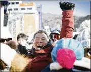  ?? MARGARET CHEATHAM WILLIAMS / NEW YORK TIMES ?? Jong Jin Kim, Chloe’s father, led a family contingent that included her grandmothe­r, who saw Chloe Kim compete for the first time.
