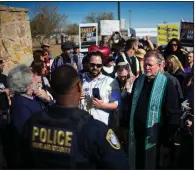  ?? AP/IVAN PIERRE AGUIRRE ?? Religious leaders gather earlier this month outside the Tornillo, Texas, detention facility to talk with a Department of Homeland Security official.