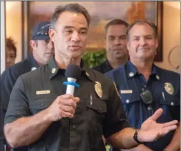  ?? Eddy Martinez/For The Signal ?? Derek Alkonis, Los Angeles County assistant fire chief, answers questions for residents of the Oakmont on Friday afternoon.