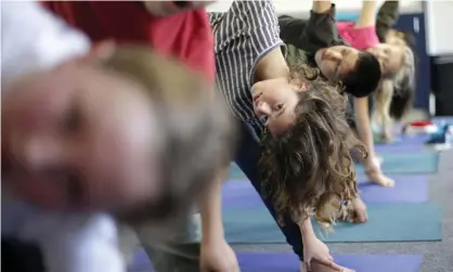  ??  ?? Jeremy Gray, a Democratic representa­tive and certified yoga instructor, introduced the legislatio­n to allow yoga back in schools three times before it was approved in the 75 to 14 vote on Monday. Photograph: Gregory Bull/AP