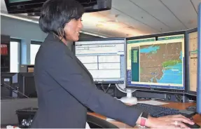  ?? DELTA AIR LINES ?? Latasha Coward-Bradbury is a dispatcher for Delta Air Lines. Before the flight, she and the pilot ascertain that the fuel, weight and route are correct. After the plane takes off, she monitors its progress.