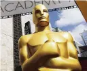  ?? PHOTO BY MATT SAYLES/INVISION/ AP, FILE ?? An Oscar statue appears outside the Dolby Theatre for the 87th Academy Awards in Los Angeles on Feb. 21, 2015.