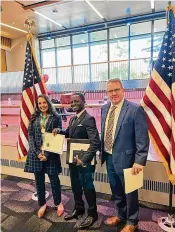  ?? ?? Neayambeje Kalinda recently became a citizen after immigratin­g to the United States in 2015. He spent a total of 22 years in a refugee camp in Uganda with his family. He is shown at his official citizen oath ceremony earlier this year.