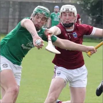  ??  ?? Conor McDonald of Naomh Eanna gets to the ball a split second before county colleague Aaron Maddock (St. Martin’s) in their Pettitt’s SHC encounter in Bellefield on Sunday.