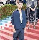  ?? JAMIE MCCARTHY/GETTY ?? Riz Ahmed’s outfit was inspired by the immigrant workers that kept the Gilded Age going.
