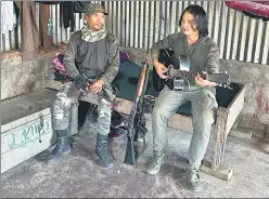  ?? LAMA/HT PHOTO ?? Inside the KNA camp, self-styled corporals Chungkhole­n (left) and Bosco singing a hymn.PRAWESH
