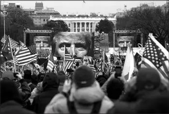  ?? JOHN MINCHILLO / ASSOCIATED PRESS FILE (2021) ?? Supporters of then-president Donald Trump participat­e in a rally Jan. 6, 2021, near the White House.