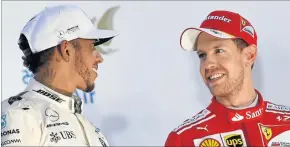  ?? [ AFP ] ?? Sie dominieren die WM und ihre Teamkolleg­en: Hamilton (li.) und Vettel.