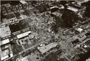  ?? Julio Cortez / Associated Press ?? Debris and rubble cover the ground in the aftermath of an explosion in Baltimore on Monday. The gas explosion leveled three homes in the city.