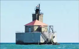  ?? Roger Schneider Associated Press ?? A NONPROFIT group has spent 30 years and half a million dollars restoring Port Austin Reef Light off the Michigan shore. And the work is far from over.