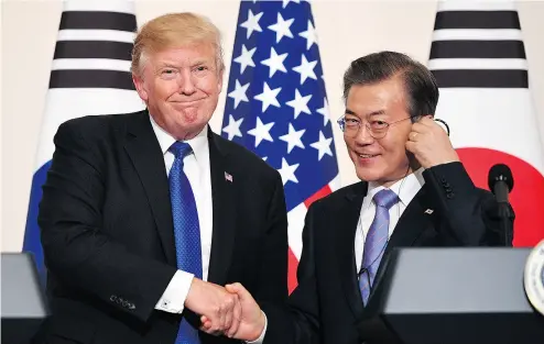  ?? JIM WATSON / AFP / GETTY IMAGES ?? U. S. President Donald Trump with South Korea President Moon Jae-In at the presidenti­al Blue House in Seoul on Tuesday. Trump’s administra­tion has proven to be astonishin­gly ineffectiv­e, Kelly McParland writes.