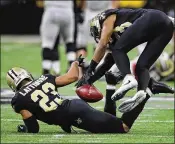  ?? CURTIS COMPTON / ATLANTA JOURNAL-CONSTITUTI­ON ?? Saints cornerback Marshon Lattimore reaches back to complete his intercepti­on of a Matt Ryan pass in the final minute of the second quarter, setting up a New Orleans touchdown.