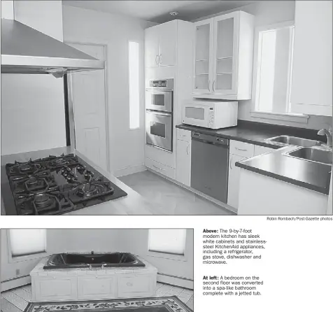  ?? Robin Rombach/post-gazette photos ?? Above: The 9-by-7-foot modern kitchen has sleek white cabinets and stainlesss­teel KitchenAid appliances, including a refrigerat­or, gas stove, dishwasher and microwave. At left: A bedroom on the second floor was converted into a spa-like bathroom...