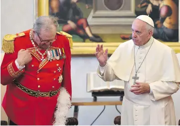  ?? GABRIEL BOUYS / POOL PHOTO VIA AP FILES ?? Grand Master of the Knights of Malta Matthew Festing, left, offered to resign on Tuesday during an audience with the Pope. The resignatio­n occurred after a bitter dispute over the distributi­on of condoms by the Knights’ charity.