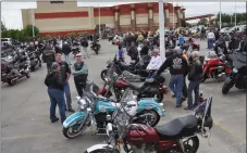  ?? ?? Motorcycli­sts gather at their bikes after a breakfast at the Living Sky Casino to start the Ride for Dad parade, June 11.