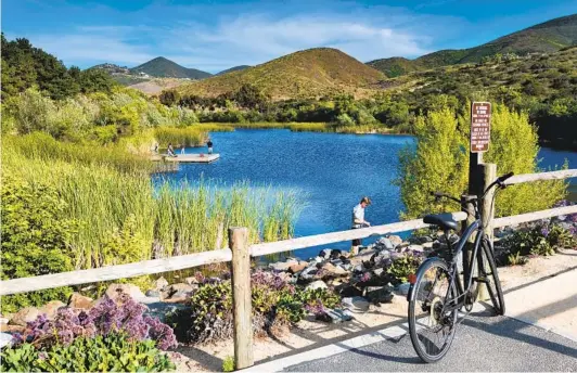  ?? COURTESY PHOTOS ?? TOP: With 36 parks and 63 miles of trails, San Marcos offers a front-row seat to nature. Plus, Rancho Tesoro residents enjoy community trails that lead to Discovery Lake.
RIGHT: With new-home pricing from the high $400,000s, Rancho Tesoro in San Marcos makes North County homeowners­hip possible.