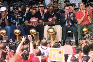 ?? AP Photo/Beth A. Keiser, File ?? ■ In this June 16, 1998, file photo, NBA Champions, from left: Ron Harper, Dennis Rodman, Scottie Pippen, Michael Jordan and coach Phil Jackson are joined on stage by Chicago Mayor Richard Daley, second from right, during a city-wide rally in Chicago to celebrate the Chicago Bulls 6th NBA championsh­ip. Jordan described his final NBA championsh­ip season with the Chicago Bulls as a “trying year.” “We were all trying to enjoy that year knowing it was coming to an end,” Jordan told Good Morning America on Thursday.